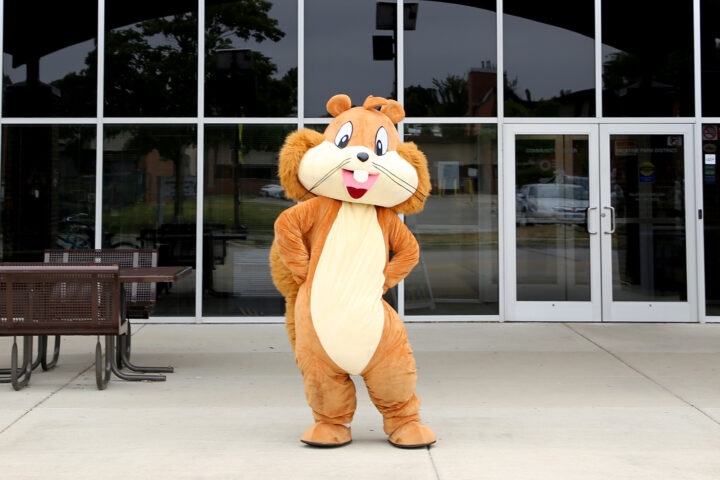 Squirrel mascot in front of the community center