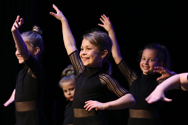 Children dancing in a performance