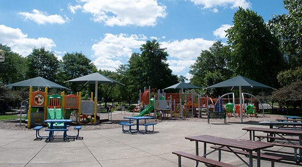 Play structure and picnic table at community park
