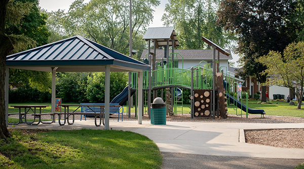 A picnic shelter and play structure at Doug Linberg park