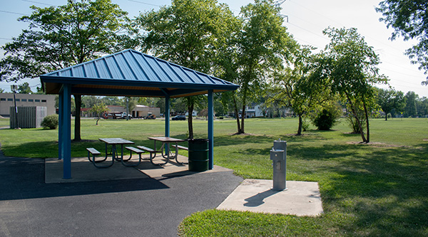 A shade structure with water fountain at Sycamore park